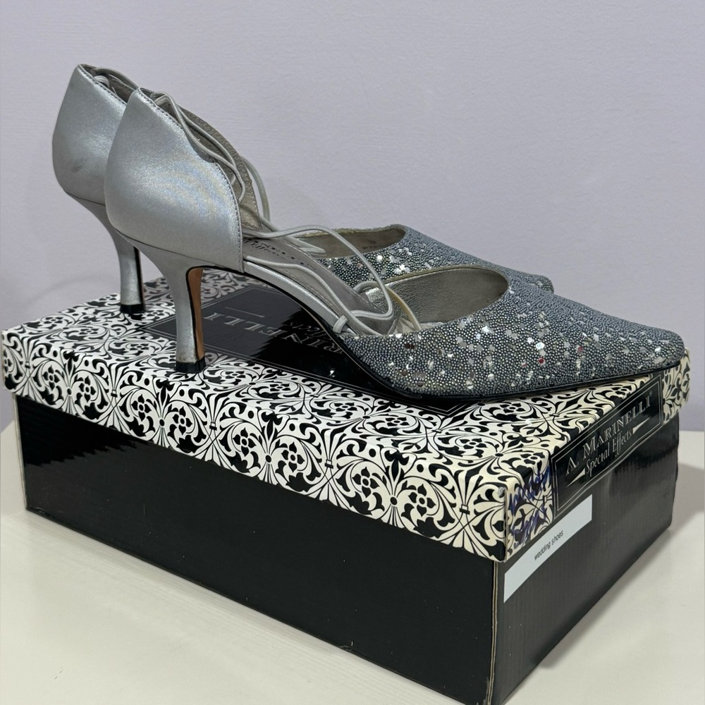 A. Marinelli size 7.5 silver sparkly heels in great condition!